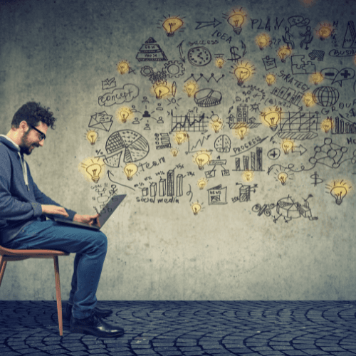 man sitting at laptop